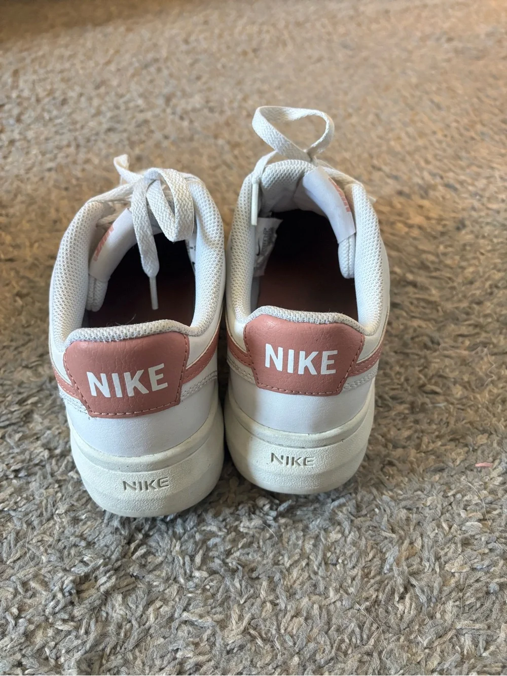 Nike Women’s White Sneakers with Rose Swoosh